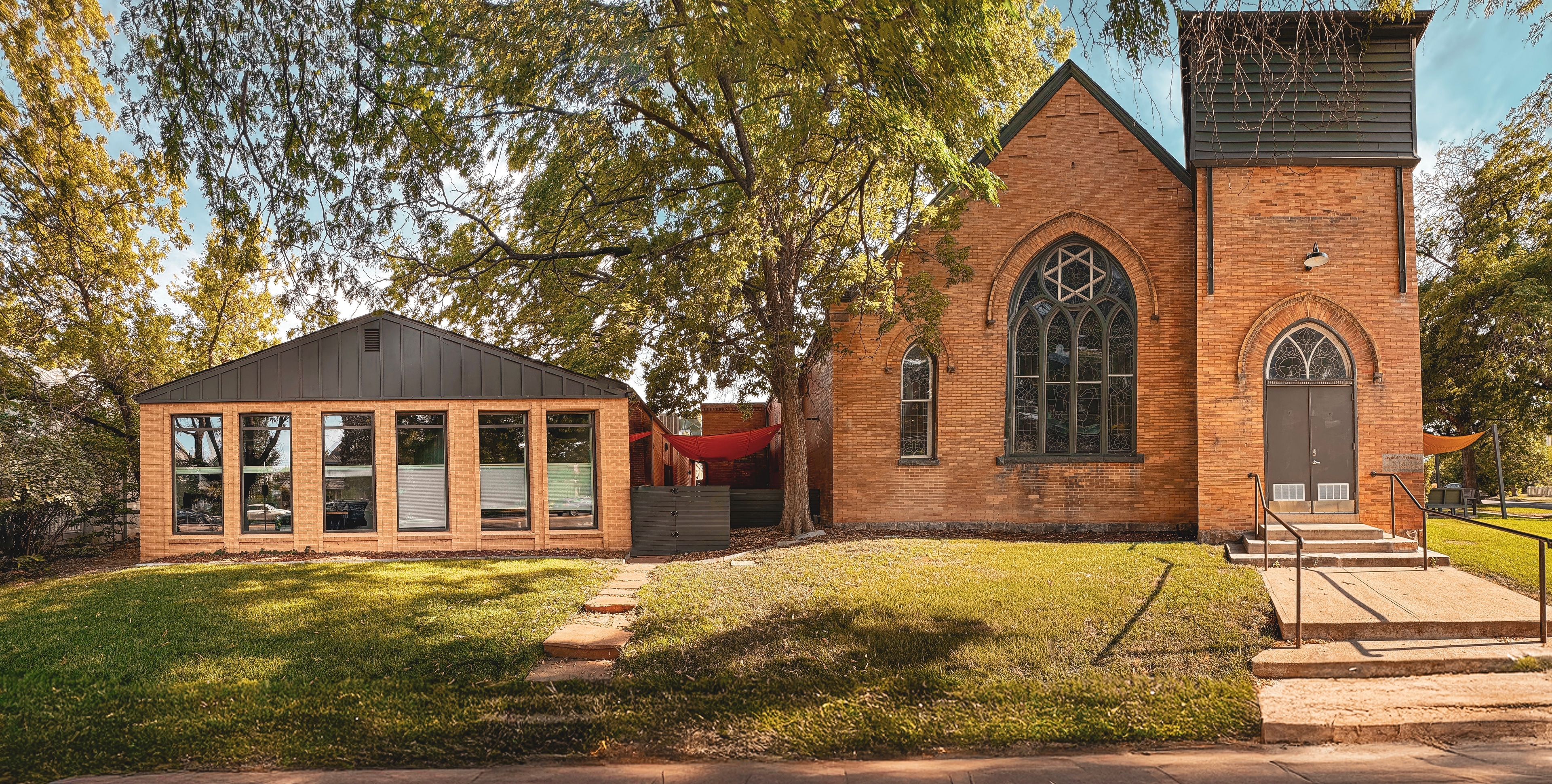 Historic Merritt Fitness sanctuary with soaring ceilings and natural light